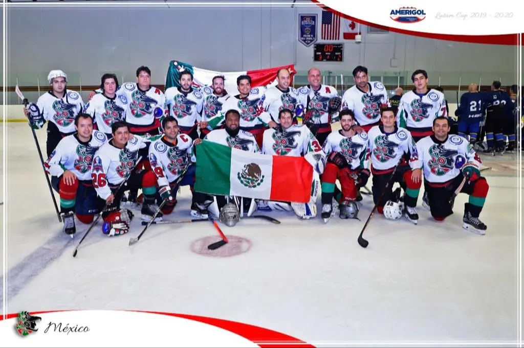 The Mexico national ice hockey team on the ice holding a Mexican flag after a Latam Cup game.